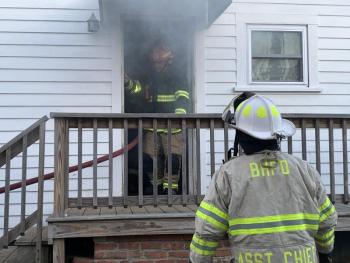 Smoke billows out the side door. KEVIN BURNHAM/Boothbay Register