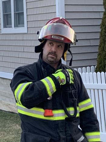 Boothbay Captain Tim Pinkham observes the younger firefighters’ work. KEVIN BURNHAM/Boothbay Register