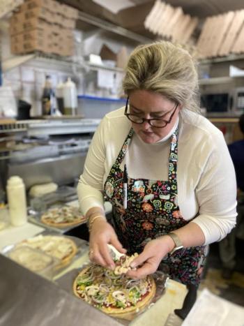 East Boothbay General Store owner-chef Liz Evans prepares a pizza. EDNA MILLER/Wiscasset Newspaper