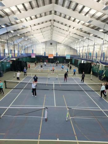 The long view of the fieldhouse, with eight pickleball courts in play. Courtesy of Nancy Baker