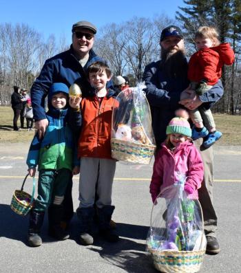 The Giant Golden Egg winners and families: from left in red, Liam Williams of East Boothbay, and Axel Barter, 2, in dad’s arms.