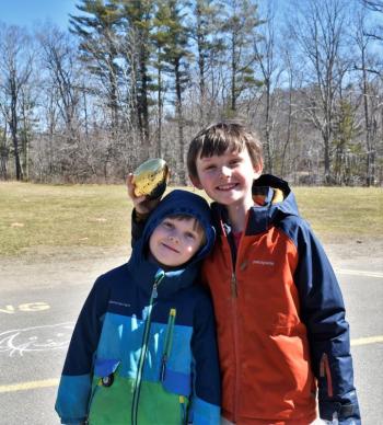 The Williams brothers, Mason, left, and giant gold egg finder, Liam, of East Boothbay. LISA KRISTOFF/Boothbay Register