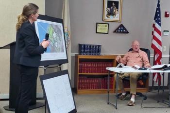 Architect Valery Tessier speaks with Boothbay Harbor planning board member Jon Dunsford about a proposed hotel on Atlantic Avenue. FRITZ FREUDENBERGER/Boothbay Register