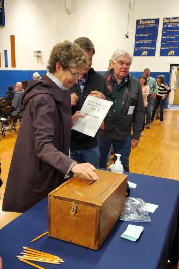 Denise Griffin submits her vote on Article 14. FRITZ FREUDENBERGER/Boothbay Register