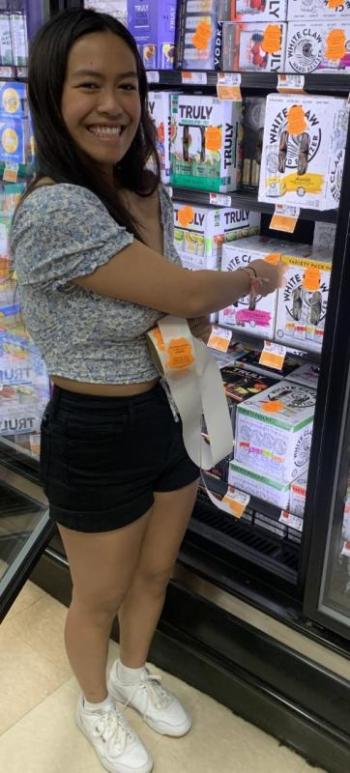 Ariel Alamo was one of the Student Health Advisory Board members who volunteered to place labels on alcohol sold in local stores to warn adults about laws covering underage drinking. BILL PEARSON/Boothbay Register
