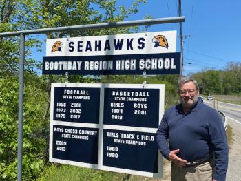 Kenneth Rayle with the Seahawks championships sign. Courtesy photo