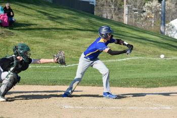 Seahawk Aidric Canada makes a safety squeeze bunt in the eventual winning play against Carrabec. FRITZ FREUDENBERGER/Boothbay Register