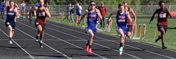 Boothbay/Wiscasset runner Aidric Canada, center, finished first in the 100M and teammate Austin Trask, to Canada’s left, finished second in the May 9 Mountain Valley Conference track meet in Wiscasset. BILL PEARSON/Boothbay Register