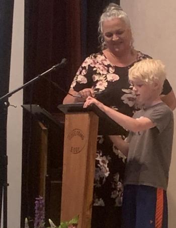 Teacher Michelle Fortin and student Gus Bezon presented sunglasses June 22 to the sixth grade class as a graduation present from the third grade. BILL PEARSON/Boothbay Register