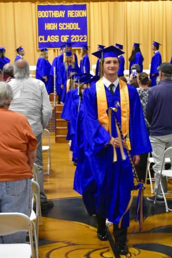 Class Marshal Gryffin Kristan leads the class of 2023 out of the gymnasium at the end of the celebration. FRITZ FREUDENBERGER/Boothbay Register