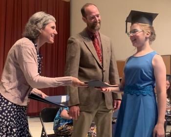 Graduate Jillian Murray receives her sixth grade diploma from Edgecomb School Committee member Nichole Price and Principal Tom Landberg. BILL PEARSON/Boothbay Register
