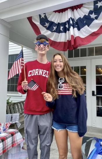 Julian Meserve and Coco Meserve celebrate the holiday in front of the Southport Memorial Library. Courtesy of Helen Meserve