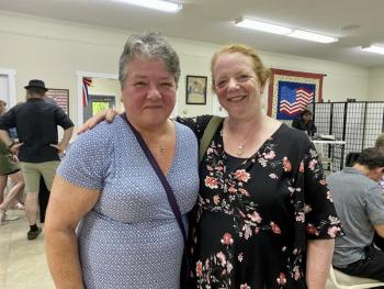 Mickey Gerhard, a volunteer for Midcoast Humane, and Suzy Cavalieri enjoy the festivities. ISABELLE CURTIS/Boothbay Register