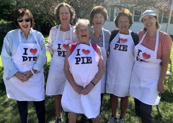 Freda Burnham, front, is all smiles Aug. 12 as she and her fellow East Boothbay United Methodist Church Women prepare to sell pies and baked goods. Also pictured, back, from left, Gay Chatham, Mary Jo Hamman, Anne Burt, Sara Kerr and Deb Moorefield. BILL PEARSON/Boothbay Register