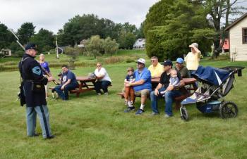 Robert Pierce explains military drills and demonstrations to Railway Museum visitors. FRITZ FREUDENBERGER/Boothbay Register