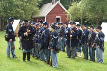 Captain Matt Bray inspects his troops’ firearms. FRITZ FREUDENBERGER/Boothbay Register