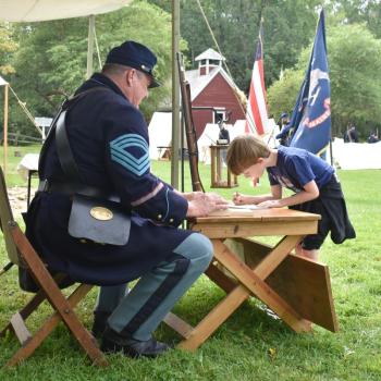 Preston Parise, 7, enlists. According to the enlisting officer, Parise was standing on a sign that read “18,” so, technically, he was “over 18” when he joined the Army. FRITZ FREUDENBERGER/Boothbay Register