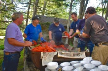 Members of the Boothbay Fire Department get their share of the lobster bake. FRITZ FREUDENBERGER/Boothbay Register