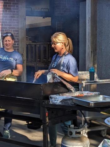 BRES Principal Shawna Kurr cooks on the grill. CANDI JONETH/Boothbay Register