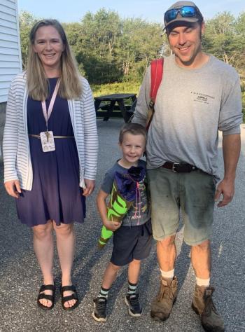 Kindergartner Jeremiah Carroll arrived on the first day of school with gifts for his classmates which is a family tradition his grandmother brought to America from Switzerland. Also pictured, teacher Nikki Tibbetts and Finn Carroll. BILL PEARSON/Boothbay Register
