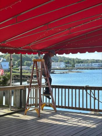 Dismantling Brady’s 800 square foot canopy. Courtesy photo