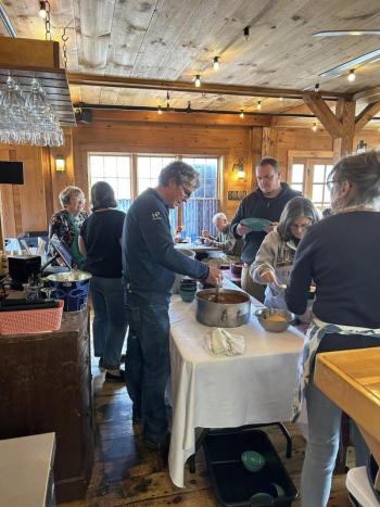 Sewall Maddocks ladles out some food. Jen Mitchell photo