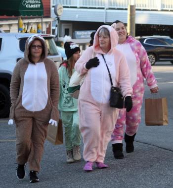 These Early Birds are sporting jammies from the warm and cozy line of morning shopping wear! File photo