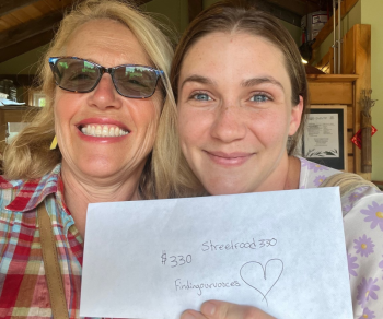 Patrisha McLean, CEO/Founder of Finding Our Voices, with Marykate Moriarty of Streetfood 330, and the proceeds of her “Into the Light!” July sales. Moriarty said “The amount of people in July who showed up just for our “Into the Light!” Mango Bango Dessert Cup was amazing.” Patrisha McLean photo
