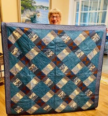 Sewing Group member, Carol Atwood Lyon donates her quilt to the project. Courtesy photo