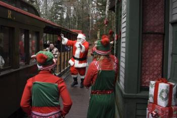 Santa and the elves greet the train. Bob Crink photo