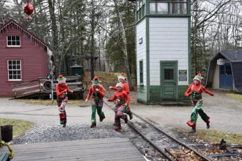 Volunteer elves run toward the station. Bob Crink photo