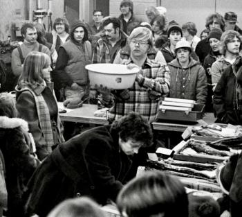 Fireman John Harvey of Wiscasset, shown holding the bowl that helped weigh in and judge the fish entries. That’s Ann Merry leaning over the scorer’s table where the fish entries were placed. PHIL DI VECE photo
