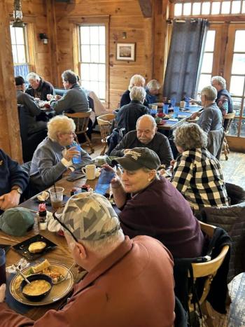 Enjoying a hot meal during Community Lunch. Courtesy photo