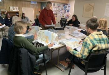 Chris Sieracki, standing, shows the Edgecomb Planning Board plans April 12 for a new home on Cross Point Road. BILL PEARSON/Boothbay Register