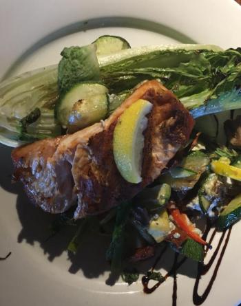 Roasted salmon on grilled romaine lettuce. Mine Oyster Restaurant. Ralph Smith photo