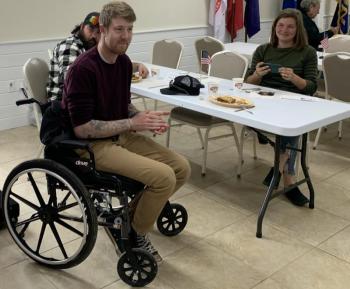 Veteran Christopher George celebrates his 31st birthday May 4 by receiving a $9,000 community contribution and a quilt. George was injured in car accident in February. He served four years in the Army and now works at Fuller Marine. Also pictured: Bree George, his wife. BILL PEARSON/Boothbay Register
