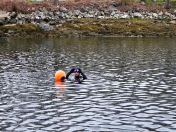 Diver Tim Pinkham replaces the orange buoy marking the siphon’s outfall that had become detached in a storm a couple of years ago. Courtesy of Merritt Blakeslee