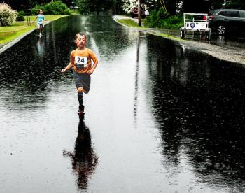Breckton Buzzell, 6, races for the finish during the Edgecomb 250th Birthday Road Race on June 22. Buzzell came in second in the kids' run. Bisi Cameron Yee photo