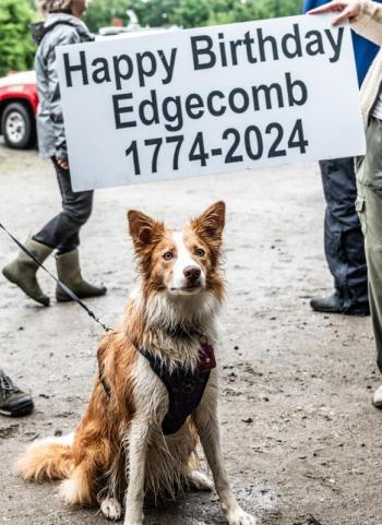 Tilly, a 2-year-old rain-drenched Border Collie, poses with the official Edgecomb birthday sign after being the last participant across the finish line during the Edgecomb 250th Birthday Road Race on June 22. Tilly successfully completed the 10K leg at a leisurely pace of approximately 1 hour and 34 minutes. Bisi Cameron Yee photo