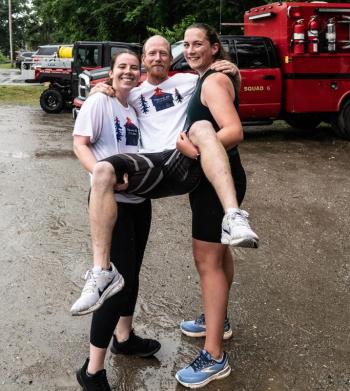 Megan Kelly, left, and Leonie Dewaele, right, give a lift to 5K winner D.J. Kelly after all three participated in the Edgecomb 250th Birthday Road Race on June 22. The three Boothbay Harbor residents were among 54 runners undeterred by the morning’s weather. Bisi Cameron Yee photo