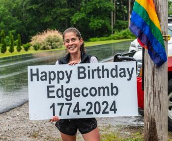 Maura Nicholson wishes the Town of Edgecomb a happy birthday after finishing second in the 5K leg of the Edgecomb 250th Birthday Road Race on June 22. Bisi Cameron Yee photo