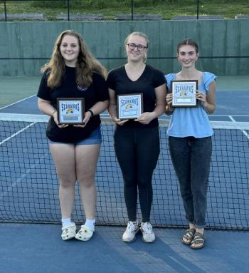 The Boothbay Region High School girls tennis team held its awards ceremony outside on the tennis courts on Tuesday, June 11 and these players received post-season plaques. From left are Ivory Cody, Coach’s Award; Hannah Kreft, Most Improved Player; and Laura Chapman, Most Valuable Player. Courtesy of Alex Arsenault