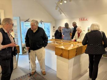 First Friday friends and visitors at Gold/Smith Gallery visit with artist John Vander, far left, and Karen Swartsberg near the windows. LISA KRISTOFF/Boothbay Register
