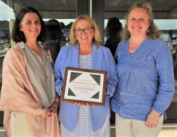 Holly Stover, center, Development Director for Lincoln County Dental accepted the Coulombe Center Award for Innovation from Anni Pat McKenney, left, Director of the Coulombe Center for Health Improvement and keynote speaker Sarah Sherman, Director of Strategic Partnerships at the Maine Bureau of Veterans’ Services. Courtesy of LincolnHealth