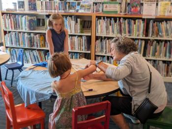 Children make upcycled book bags out of old T-shirts. CANDI JONETH/Boothbay Register