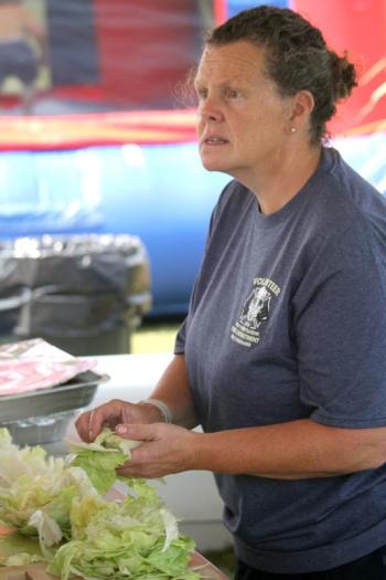 Jen Sledge tends to the lettuce. STEVE EDWARDS/Boothbay Register