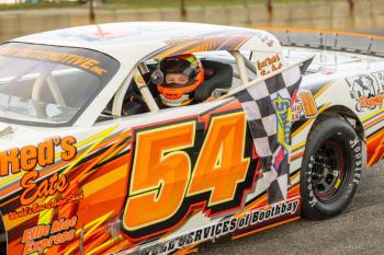 Noah Haggett carries the checkered following his win in the Super Streets. Jasen Dickey Photography