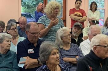 Resident Nancy Harriman spoke at the July 24 special town meeting in favor of the land use amendment which excludes public utilities from blasting regulations. BILL PEARSON/Boothbay Register
