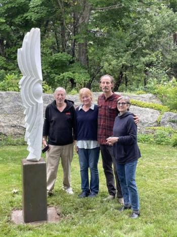 “Seed,” a white marble sculpture by Chris Lewis, second from right, after its installation at Kerr+Jones in East Boothbay, the latest location on the Boothbay Region Sculpture Trail. From left: BRST board member Bill Royall, Diana Kerr, Lewis, and Kathleen Jones. Courtesy of Diana Kerr