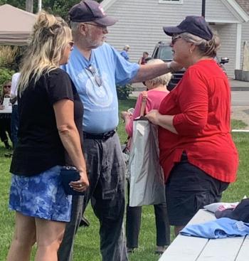 V.E.T.S. Inc. founder Ed Harmon Sr. visits with barbecue guests Aug. 17 during the annual fundraiser for the homeless veterans program. BILL PEARSON/Boothbay Register